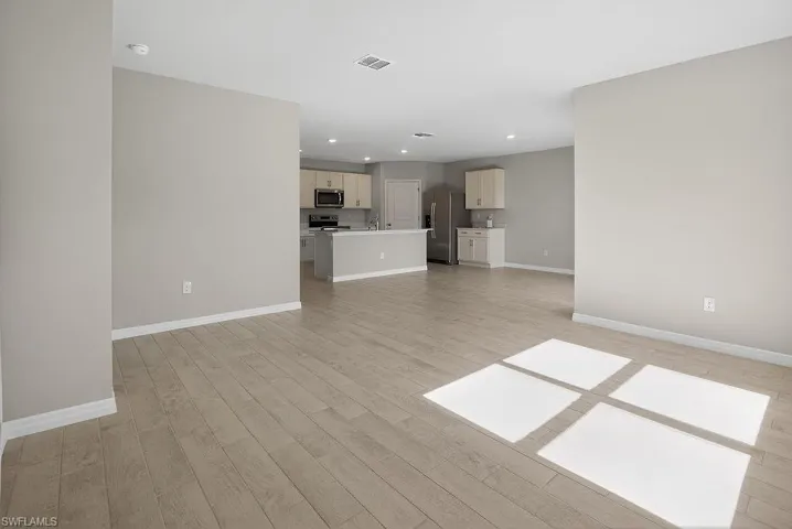 Unfurnished living room featuring recessed lighting and light wood-style floors