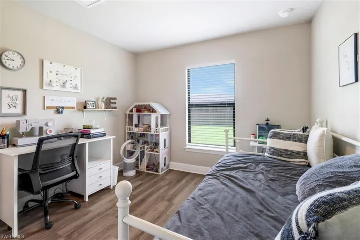 Bedroom featuring wood-type flooring