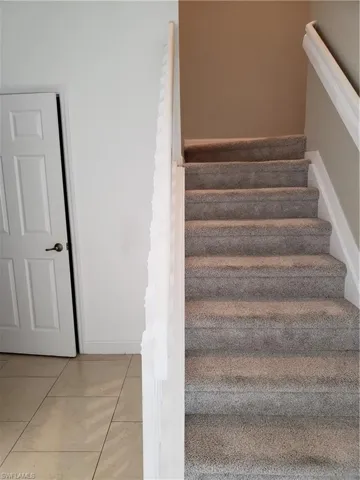 Up the carpeted stairs to the bedroom and bonus room