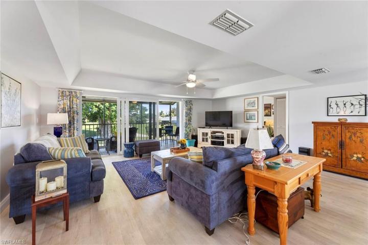 Large living area leading to lanai and a fabulous view of the 3rd fairway of the Pines