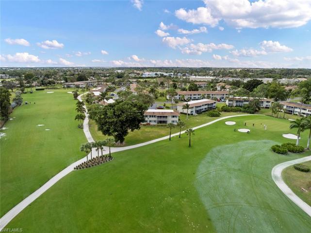 Arial View of the Pines approach to green. Condo sits behind the large tree.