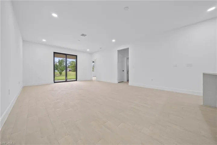 Spare room with recessed lighting and light wood-style flooring
