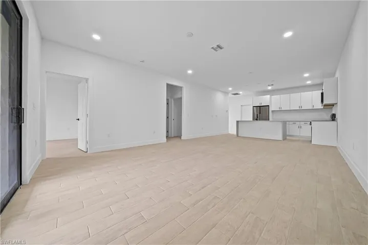 Unfurnished living room featuring recessed lighting and light wood-style flooring