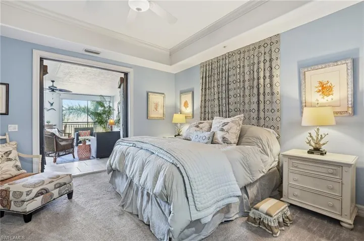 Carpeted bedroom featuring ornamental molding, access to outside, and a ceiling fan