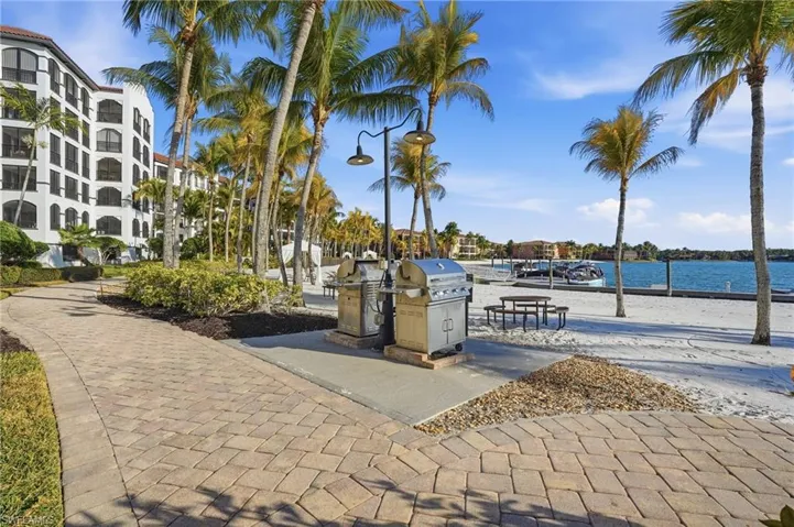 View of home's community featuring a water view and grills