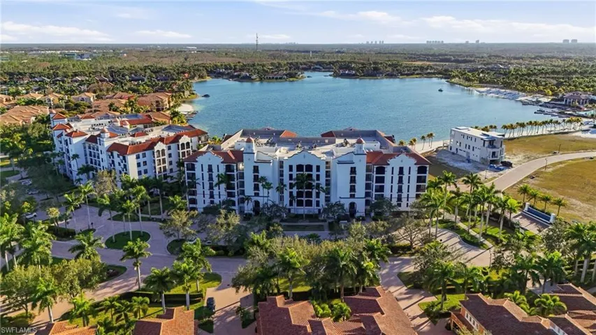 Bird's eye view of a nearby body of water and apartment complex / building