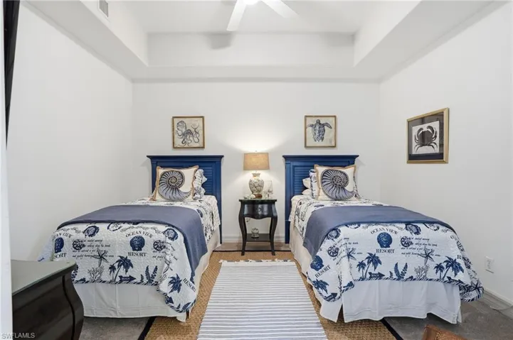 Bedroom with ceiling fan and baseboards