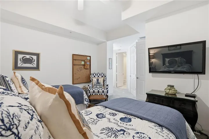 Bedroom featuring carpet and ceiling fan