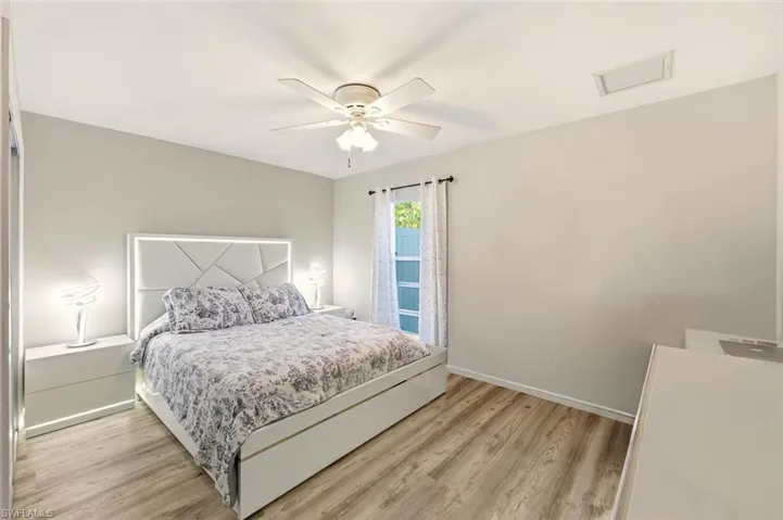 Bedroom with light wood-style flooring and ceiling fan