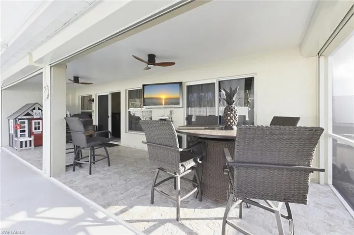 View of patio / terrace with outdoor dining space and ceiling fan