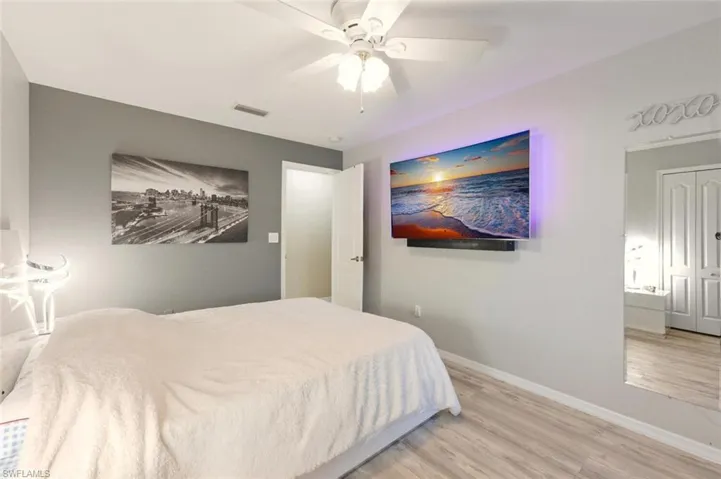 Bedroom featuring wood finished floors and a ceiling fan