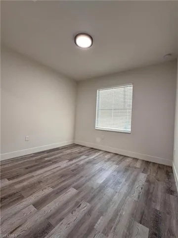 Spare room with hardwood / wood-style floors
