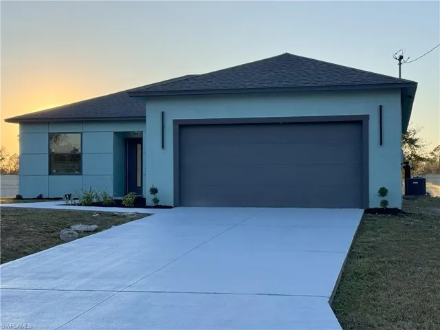 Ranch-style house featuring a garage