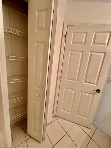 Tiled Kitchen Pantry and Garage Entry Door