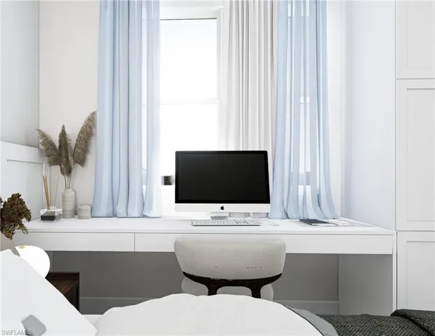 Office area featuring built in desk