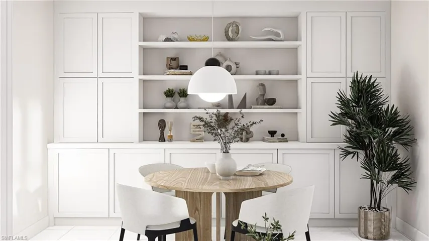 Dining space with light tile patterned flooring