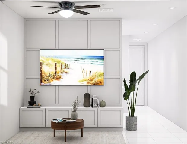 Living area featuring a decorative wall, light tile patterned floors, ceiling fan, and recessed lighting