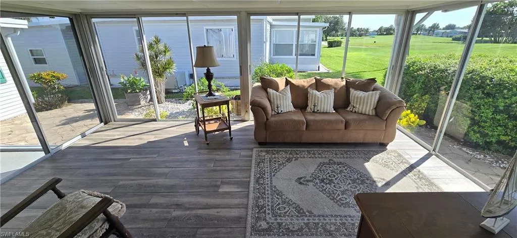 Sunroom with view of golf course