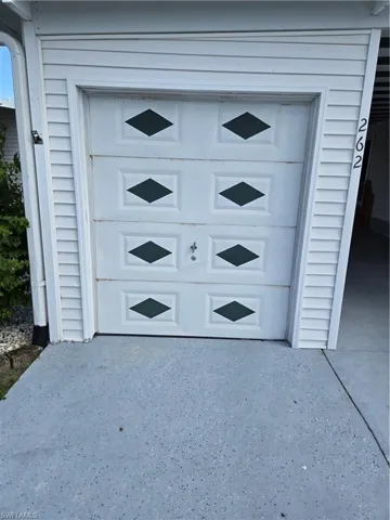 Garage with concrete driveway