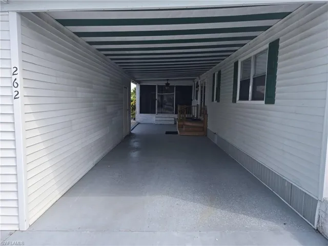 View of patio / terrace featuring a carport