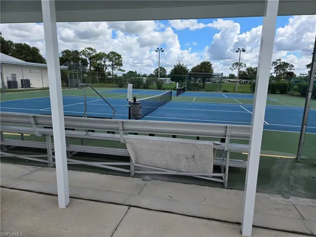 View of tennis court with fence