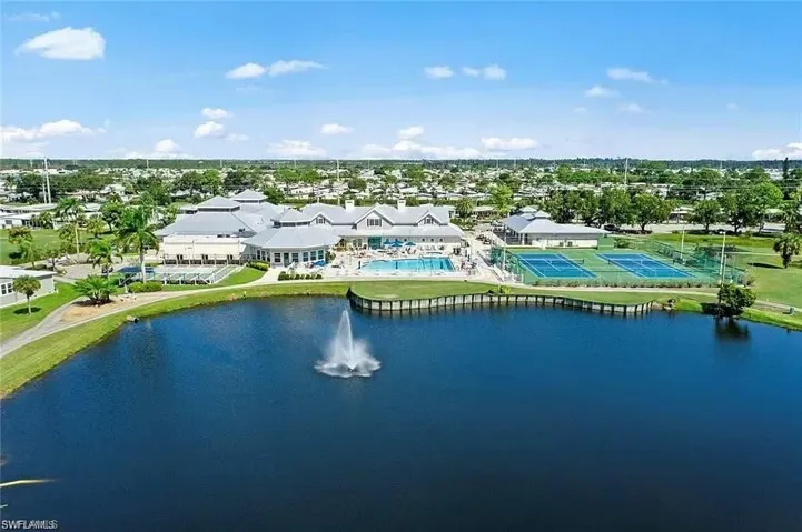 Aerial perspective of suburban area with a nearby body of water