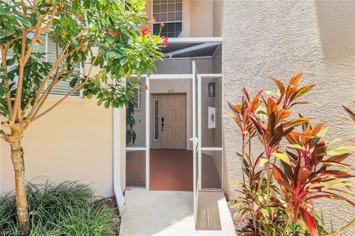 Entrance to property featuring stucco siding