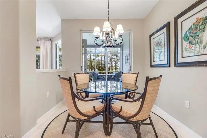 Dining space featuring a chandelier and light tile patterned floors