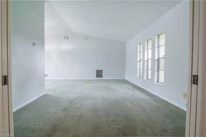 Living And Dining Rooms With Soaring Vaulted Ceilings.