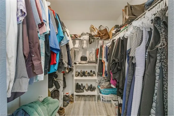 Walk in closet featuring light wood-type flooring