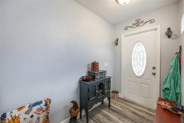 Entryway with light wood finished floors