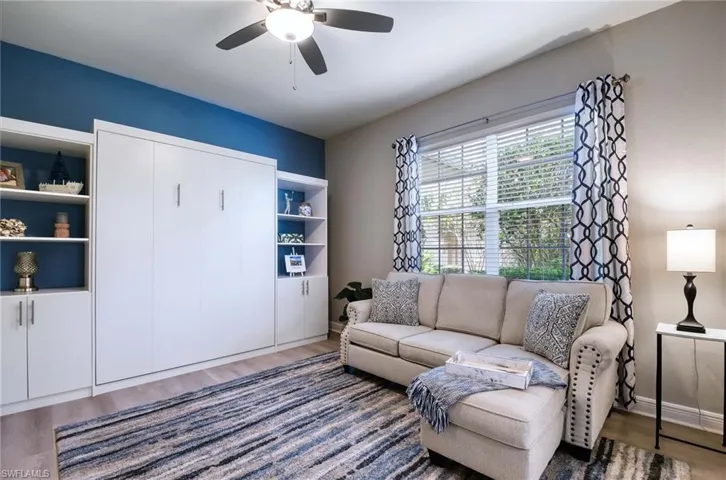 Living room with Queen Murphy bed, when opened does not crowd the room.