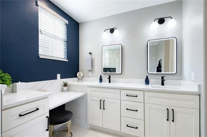 Bathroom with vanity and tile patterned floors