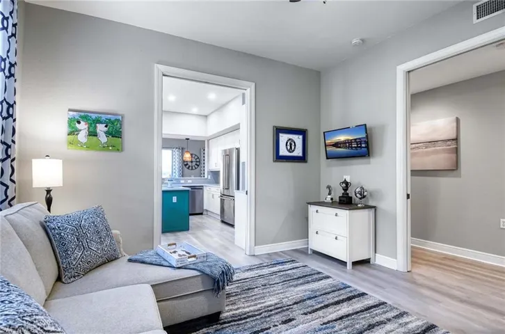 Living room with light hardwood / wood-style flooring