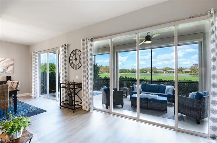 Doorway to outside with hardwood / wood-style floors and ceiling fan