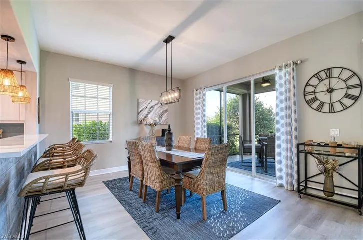 Dining room with a wealth of natural light and light hardwood / wood-style flooring