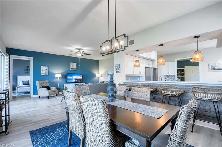 Dining room featuring hardwood / wood-style flooring, ceiling fan, and sink