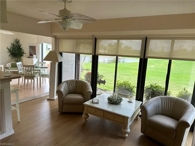 Den or Sunroom featuring ceiling fan