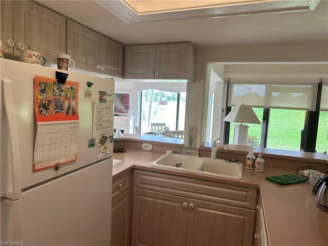 Kitchen featuring sink and white fridge
