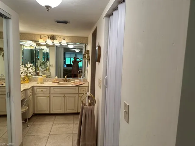 Bathroom with vanity and tile patterned flooring