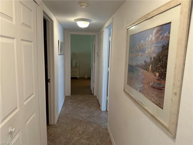 Hall with tile patterned flooring