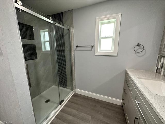 Master Tiled shower w/ glass barndoor