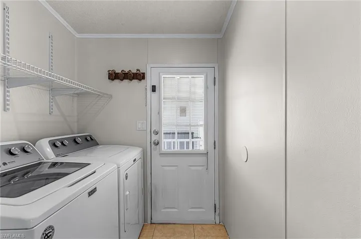 Enter through the laundry room from the carport.