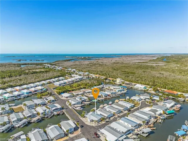 Quick access to the ICW and the Gulf with no lifts or bridges to worry about.  Pine Island Sound and Captiva are in the background.