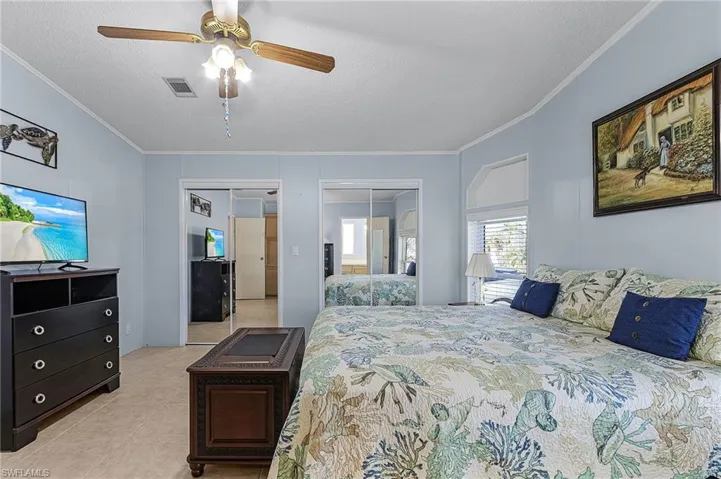 The primary bedroom is large with a room-width walk-in closet.
