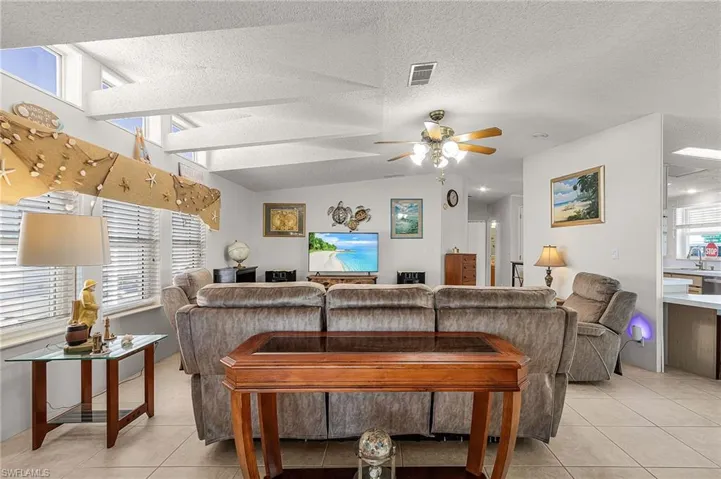 The living room has vaulted ceilings.