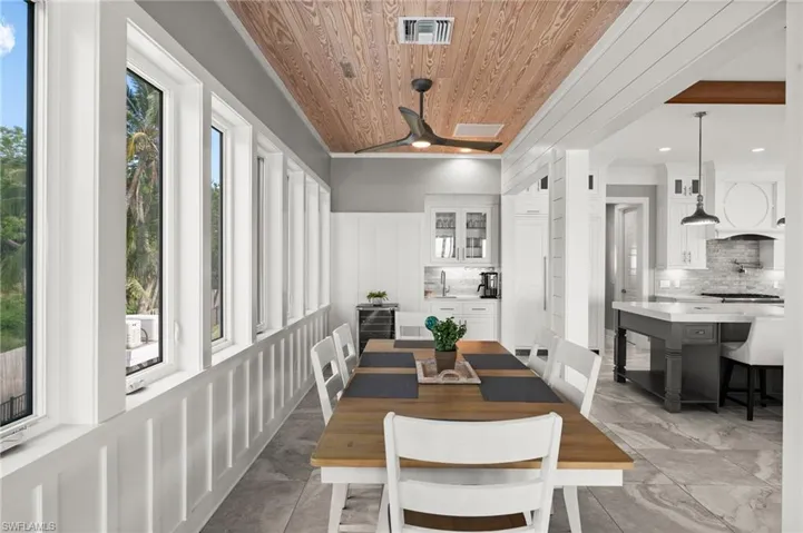 Dining space with wood ceiling, a ceiling fan, and recessed lighting