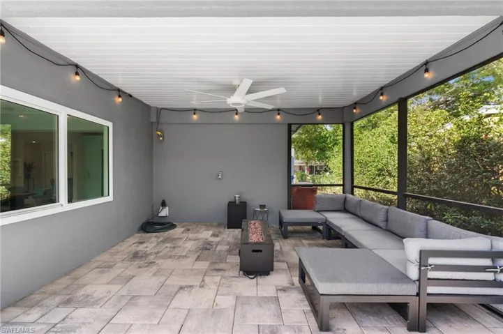 View of patio with ceiling fan and an outdoor hangout area