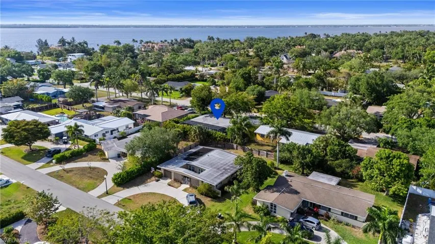 Bird's eye view featuring a water view and a residential view