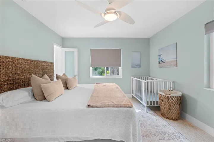 Bedroom with baseboards and a ceiling fan